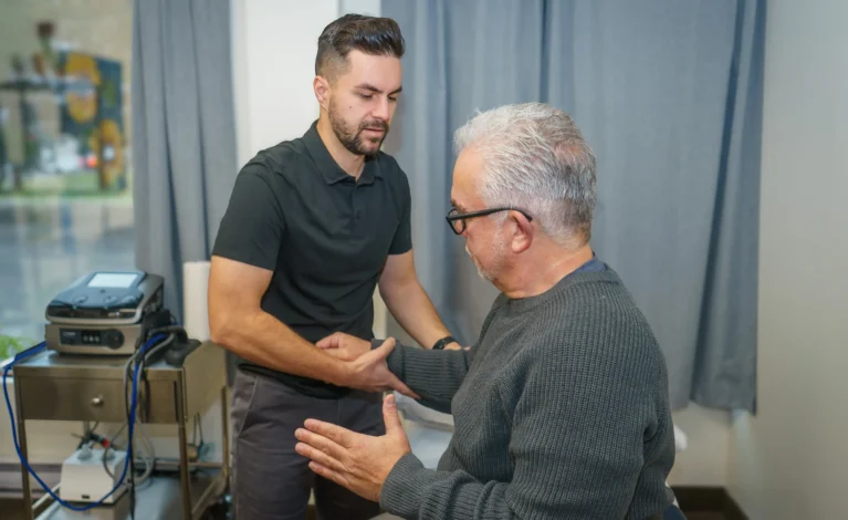 Michael Porreca providing personalized physiotherapy care to a patient in Oakville, focused on recovery and rehabilitation.