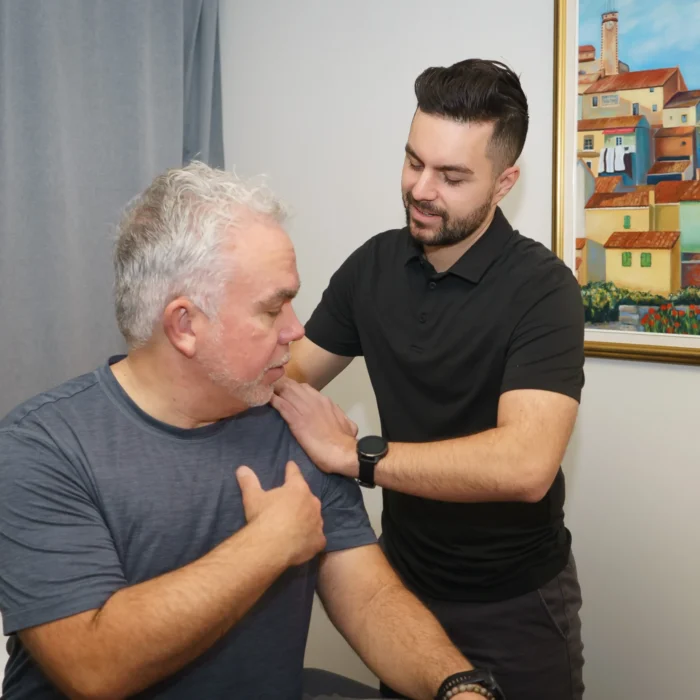 Michael Porreca providing personalized physiotherapy care to enhance recovery and physical potential at Accelerate Physiotherapy.