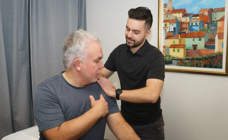 Michael Porreca providing personalized physiotherapy care to enhance recovery and physical potential at Accelerate Physiotherapy.